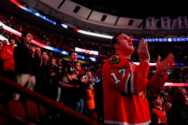 Chicago Blackhawk fans clap during the singing of the national anthem before a game between the Chicago Blackhawks and the Pittsburgh Penguins, Feb. 15, 2024, at the United Center in Chicago. (Vincent Alban/Chicago Tribune)