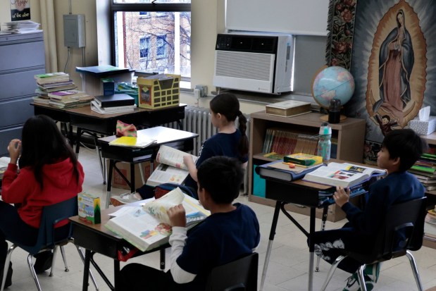 Fourth graders in their classroom at St. Odilo's Catholic Elementary School in Berwyn on Friday, Feb. 2, 2024. (Antonio Perez/ Chicago Tribune)