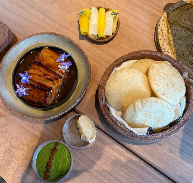 Glazed pork belly with areapas served at Merito in the trendy Barranco neighborhood of Lima. (Colleen Thomas/TNS) ** OUTS - ELSENT, FPG, TCN - OUTS **