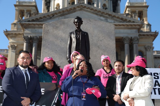 State Sen. Lakesia Collins, D-Chicago, talks about the importance of boosting base pay for all tipped workers outside of the Illinois State Capitol in Springfield on Feb. 6, 2024. (Stacey Wescott/Chicago Tribune)