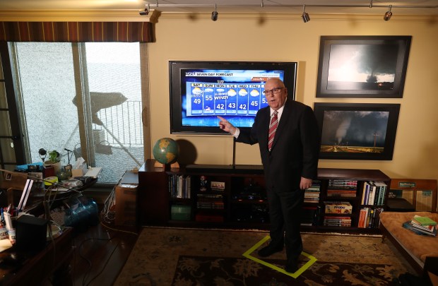 A taped-off rectangle keeps WGN Chief Meteorologist Tom Skilling in place for on-air weather forecasts while showing how he plans to work from home on April 10, 2020, in Chicago. Skilling returns to work on April 13, after taking five weeks off to recover from gastric bypass surgery and losing 50 pounds. Like his meteorology colleagues, he will be working from home due to the pandemic. (John J. Kim/Chicago Tribune)