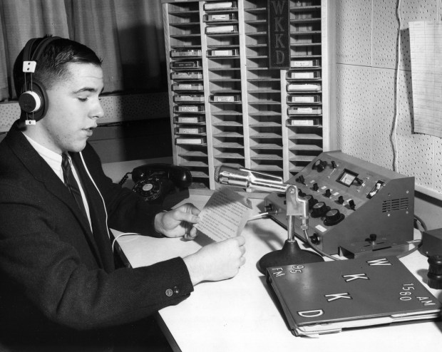 On the air with his three daily weather programs, Aurora's weather forecaster Tom Skilling, age 15 and a high school sophomore, works at WKKD radio in late 1967. (Chicago Tribune historical photo)