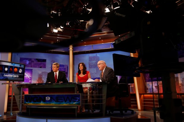 WGN Midday News co-anchors Dina Bair and Steve Sanders with Tom Skilling, right, at the WGN television studios in Chicago on July 1, 2013. (Jose M. Osorio/Chicago Tribune)