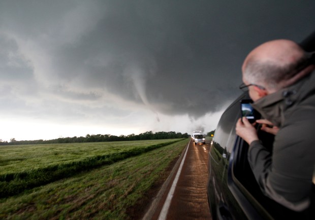 WGN-TV chief meteorologist Tom Skilling takes a photo of extreme weather from a car window while chasing tornadoes on Hwy 11 near the town of Wakita in Grand County, Oklahoma, on May 10, 2010. Wakita is where the movie "Twister" was partially filmed. (Zbigniew Bzdak/Chicago Tribune)