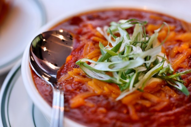 Classic beef chili bowl, loaded with sour cream, cheddar cheese, and green onions at Ramova Grill and Taproom. (Chris Sweda/Chicago Tribune)