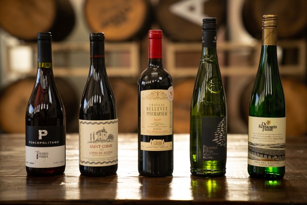 Bang for your buck wines from Binny's Beverage Depot Lincoln Park, from left, Parra Family Wines Pencopolitano 2020, $21.99, Chateau de Saint Cosme Cotes du Rhone 2022, $13.99, Chateau Bellevue Peycharneau Sainte Foy Cotes de Bordeaux 2020, $12.99, Flores Picpoul de Pinet 2022, $9.99, Dr Konstantin Frank Dry Riesling 2022, $17.99. (E. Jason Wambsgans/Chicago Tribune)