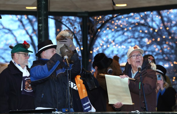 WGN weatherman Tom Skilling lets the crowd know that groundhog Woodstock Willie did not see his shadow this morning during the Groundhog Day celebration in Woodstock Square on Feb. 2, 2024, in Woodstock. This signifies that it will be an early spring. (Stacey Wescott/Chicago Tribune)