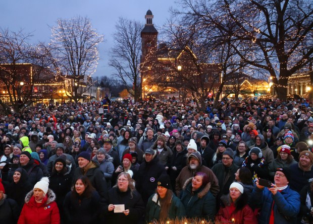 Thousands of people gather in Woodstock Square waiting for WGN weatherman Tom Skilling and groundhog Woodstock Willie's prognostication about whether or not we'll have six weeks more of winter at the Groundhog Day celebration on Feb. 2, 2024, in Woodstock. (Stacey Wescott/Chicago Tribune)