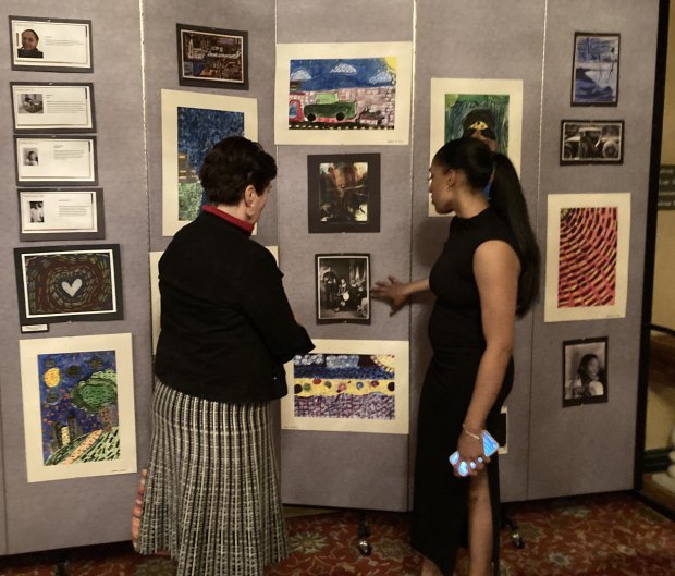 Charlotte Callahan Wozniak and Ashlei Lopez talk about a display created by Waukegan students about the Harlem Renaissance. (Steve Sadin/Lake County News-Sun)
