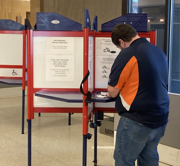 Casting the first ballot of the 2024 election cycle in Lake County is Charlie Kirk of Beach Park. (Steve Sadin/Lake County News-Sun)