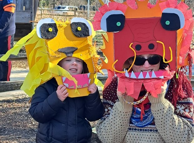 Participants model masks the made during a celebration of the Lunar New Year last weekend at the Little Red Schoolhouse in the Palos Preserves.(Cook County Forest Preserves)