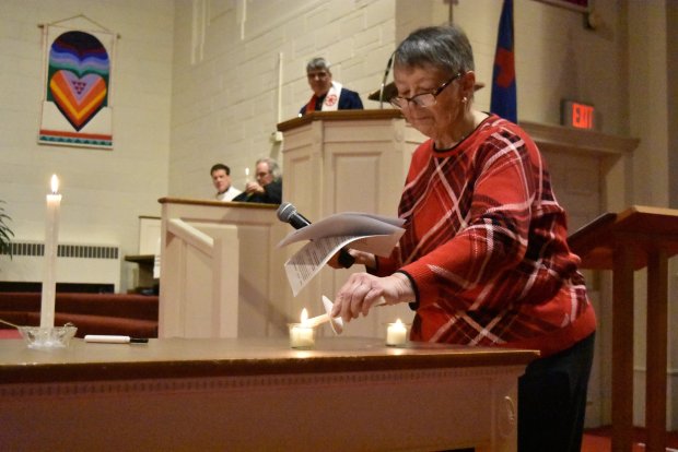 Chris Raap, a parishioner at Pilgrim Faith, lights a candle Thursday at a peace vigil.Jesse Wright/for Daily Southtown, candlelight vigill for Gaza peace, Pilgrim Faith United Church of Christ, Oak Lawn, Illinois, Feb. 1, 2024.