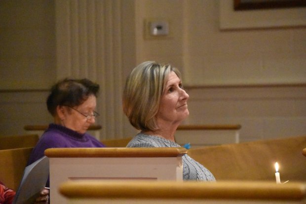 Daune Sebastian holds a candle in support of aid to those in need in the ongoing Gaza conflict.Jesse Wright/for Daily Southtown, candlelight vigill for Gaza peace, Pilgrim Faith United Church of Christ, Oak Lawn, Illinois, Feb. 1, 2024.