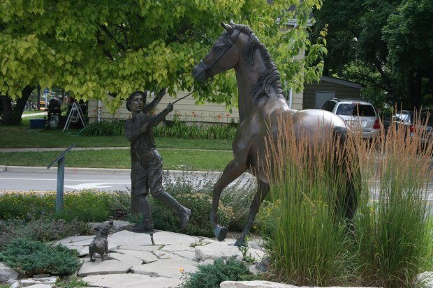 "Horse Market Days," a sculpture commissioned by Naperville Century Walk, sits outside Naper Settlement in homage to the city's days as a horse market town. (Naperville Century Walk)