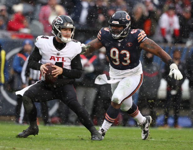 Bears defensive tackle Justin Jones pressures Falcons quarterback Taylor Heinicke on Dec. 31, 2023, at Soldier Field. (Brian Cassella/Chicago Tribune)