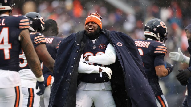 Bears cornerback Jaylon Johnson celebrates with teammates Dec. 31, 2023, at Soldier Field.