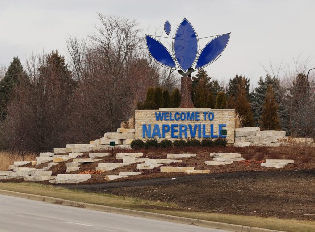 Naperville "Welcome to Naperville" sign on Washington Street, near Royce Road, at the city's border with Bolingbrook incorparates elements of the city's logo into its design.