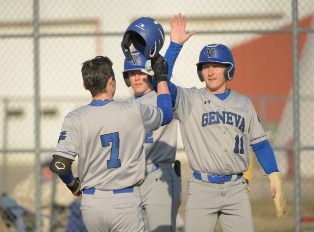 Geneva's Roland Sorrentino (7) and Joe Cosentino (11) celebrate a two run home run against Yorkville on Thursday, March 21, 2024. (Mark Black / for the Beacon-News)