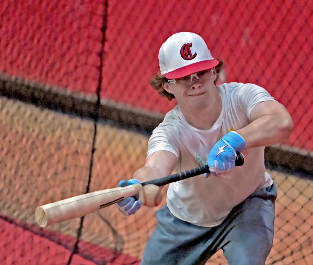 Kyle Koerner, starting pitcher for the season opener for the Aurora Christian baseball team, takes some batting practice the next day after losing to West Aurora, Thursday, March 14, 2024, in Aurora, Illinois. (Jon Langham/for the Beacon-News)