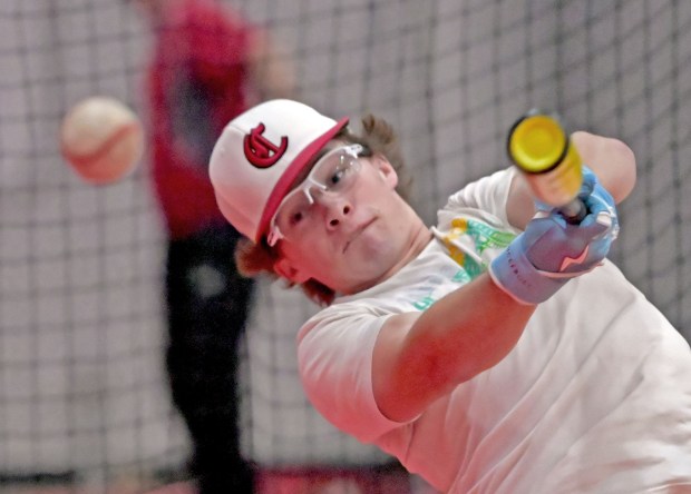 Kyle Koerner, starting pitcher for the season opener for the Aurora Christian baseball team, takes some batting practice the next day after losing to West Aurora, Thursday, March 14, 2024, in Aurora, Illinois. (Jon Langham/for the Beacon-News)