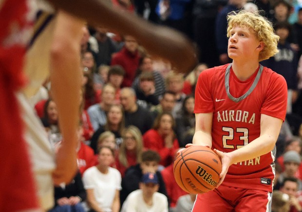 Aurora Christian's Asa Johnson (23) aims for a three point basket against Serena during the Class 1A Harvest Christian Sectional final on Friday, March, 1, 2024 in Elgin.H. Rick Bamman / For the Beacon-News