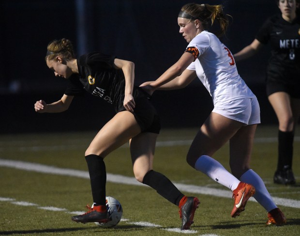 Metea Valley's Kaylee Hansen (19) works towards the goal against Oswego's Gillian Young (3) during a nonconference game Tuesday, March 12, 2024 in Aurora, IL. (Steve Johnston/for the Beacon-News)