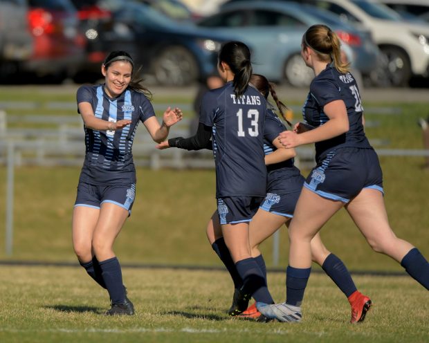 IMSA's Eliana Nungaray (5) celebrates one of her goals against Plano with teammate during a game at home in Aurora on Friday, March 15, 2024. (Mark Black / for the Beacon-News)