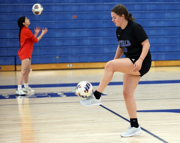 Rosary senior and avid reader Abby Cibulskis, right practices at the school in Aurora on Monday, March, 18, 2024.H. Rick Bamman / For the Beacon News