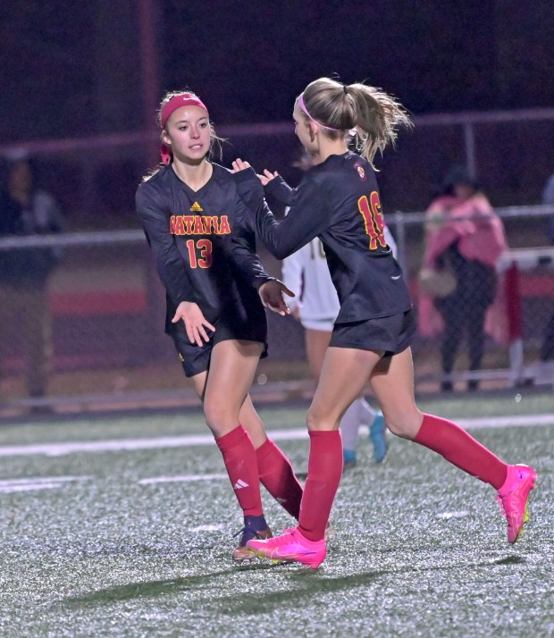 Batavia's Abi Edwards gets congratulations from teammate Reese Recker after scoring another goal. Batavia defeated Streamwood 7-0 in a girls soccer match, Thursday, March 21, 2024, in Batavia, Illinois. (Jon Langham/for the Beacon-News)