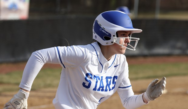 St. Charles North's Paige Murray (15) runs to first during a scrimmage game on Tuesday, March 19, 2024 in St. Charles.H. Rick Bamman / For the Beacon-News