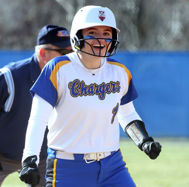 Aurora Central Catholic's Kate Gambro (1) reacts to her triple in the first inning against Trinity during a non conference game on Wednesday, March 27, 2024 in Aurora.H. Rick Bamman / For the Beacon-News