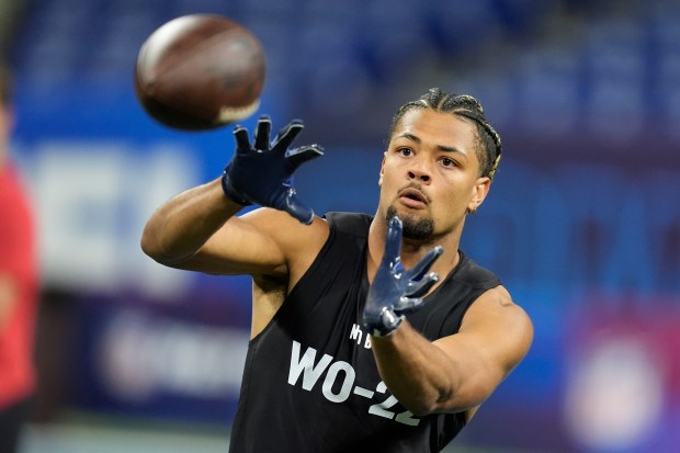 Washington wide receiver Rome Odunze runs a drill at the NFL scouting combine on March 2, 2024, in Indianapolis. (Michael Conroy/AP)