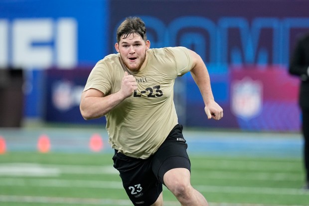 West Virginia offensive lineman Zach Frazier runs a drill at the NFL football scouting combine, Sunday, March 3, 2024, in Indianapolis. (AP Photo/Darron Cummings)