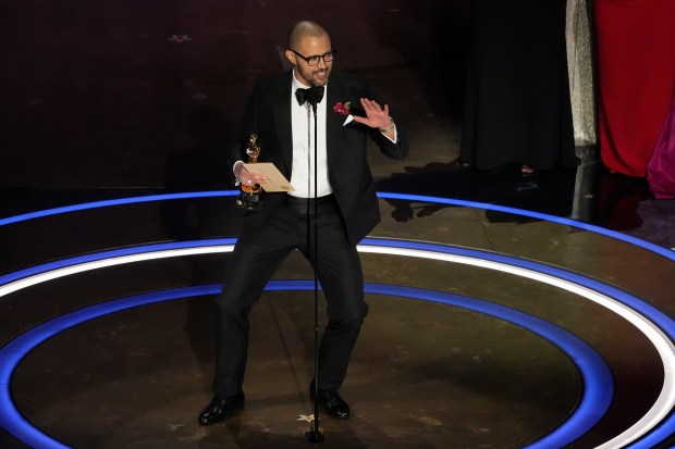 Cord Jefferson accepts the award for best adapted screenplay for "American Fiction" during the Oscars on Sunday, March 10, 2024, at the Dolby Theatre in Los Angeles. (AP Photo/Chris Pizzello)