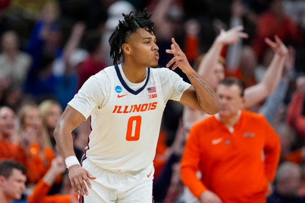 Illinois guard Terrence Shannon Jr. (0) celebrates after a three-point basket against Duquesne in the second half of a second-round college basketball game in the NCAA Tournament, Saturday, March 23, 2024, in Omaha, Neb. (AP Photo/Charlie Neibergall)