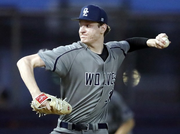 Oswego East's Noah Schultz faces an Oswego batter during a Southwest Prairie Conference game on May 12, 2022. (H. Rick Bamman / The Beacon-News)