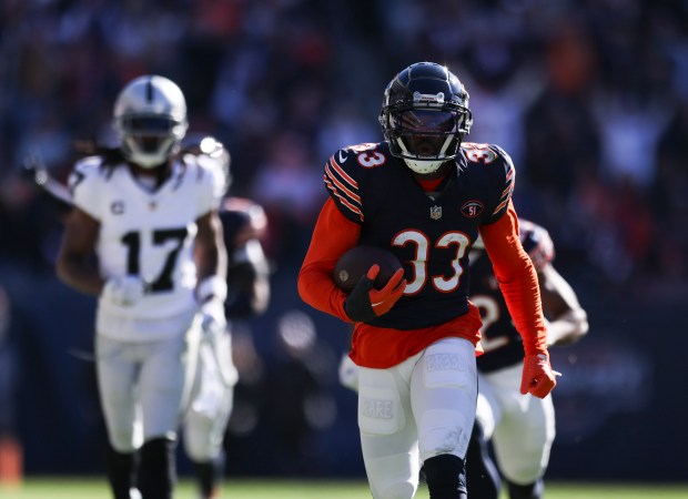 Chicago Bears cornerback Jaylon Johnson returns an interception for a touchdown during the fourth quarter against the Las Vegas Raiders at Soldier Field on Sunday, Oct. 22, 2023.