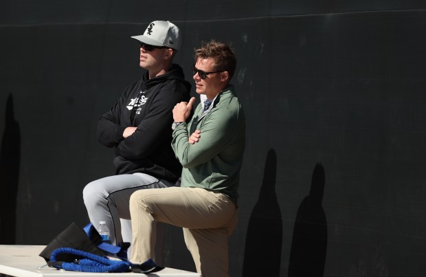 White Sox general manager Chris Getz, right, watches a workout on Feb. 21, 2024, at Camelback Ranch in Glendale, Ariz.  (Stacey Wescott/Chicago Tribune)