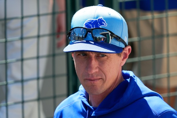 Cubs manager Craig Counsell pauses in the dugout prior to a spring training game against the Athletics on March 14, 2024, in Mesa, Ariz. (AP Photo/Ross D. Franklin)