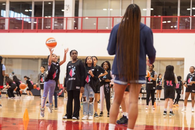 Girls take turns at different skill stations with help from Chicago Bulls staff during the Girls' Day of Play? clinic at the Advocate Center Sunday, March 3, 2024, in Chicago. (Vincent D. Johnson/for the Chicago Tribune)