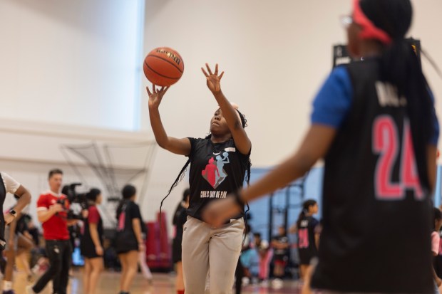 Lauren, a participant at the Girls' Day of Play? clinic, shoots the ball during drills at the Advocate Center Sunday, March 3, 2024, in Chicago. (Vincent D. Johnson/for the Chicago Tribune)