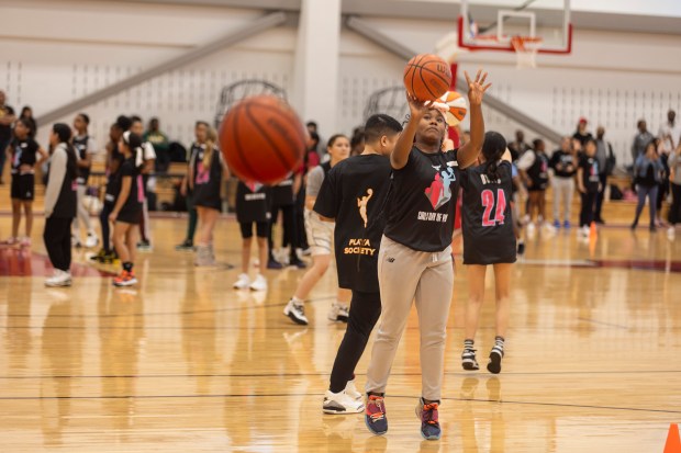 Lauren, a participant at the Girls' Day of Play? clinic, shoots the ball during drills at the Advocate Center Sunday, March 3, 2024, in Chicago. (Vincent D. Johnson/for the Chicago Tribune)