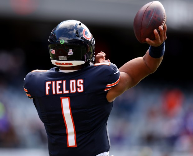 Bears quarterback Justin Fields warms up for a game against the Vikings at Soldier Field on Oct. 15, 2023. (Chris Sweda/Chicago Tribune)