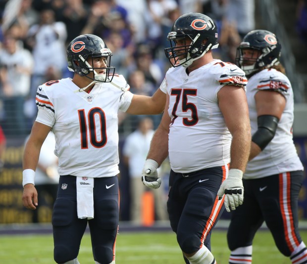Bears quarterback Mitch Trubisky (10) pats guard Kyle Long (75) on the back during a game against the Ravens on Oct. 15, 2017, in Baltimore. (John J. Kim/Chicago Tribune)
