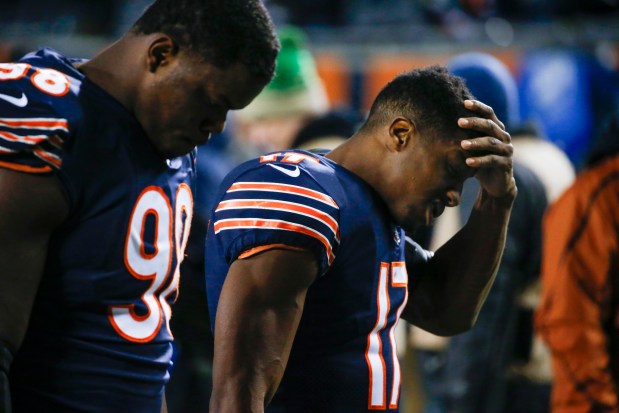 Bears wide receiver Anthony Miller, right, and defensive tackle Bilal Nichols walk off the field after a 16-15 loss to the Eagles in an NFC wild-card game on Jan. 6, 2019, at Soldier Field. (Jose M. Osorio/Chicago Tribune)