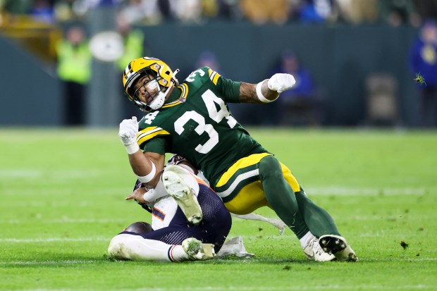 Packers safety Jonathan Owens hits Bears quarterback Justin Fields on Jan. 7, 2024, at Lambeau Field. (Eileen T. Meslar/Chicago Tribune)