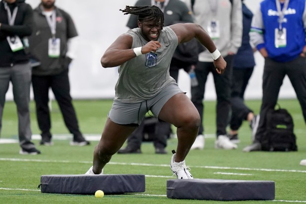 Penn State offensive tackle Olu Fashanu runs a drill during the team's pro day on March 15, 2024, in State College, Pa. (AP Photo/Matt Freed)