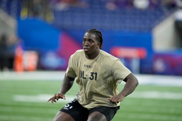 Oklahoma offensive lineman Tyler Guyton runs a drill at the NFL scouting combine on March 3, 2024, in Indianapolis. (AP Photo/Darron Cummings)