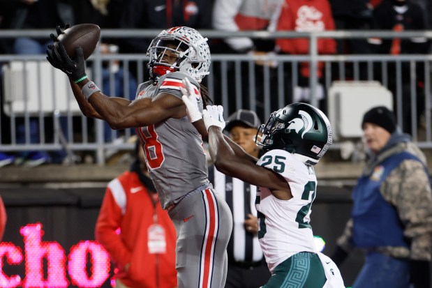 Ohio State wide receiver Marvin Harrison catches a touchdown pass against Michigan State on Nov. 11, 2023, in Columbus, Ohio. (AP Photo/Jay LaPrete)