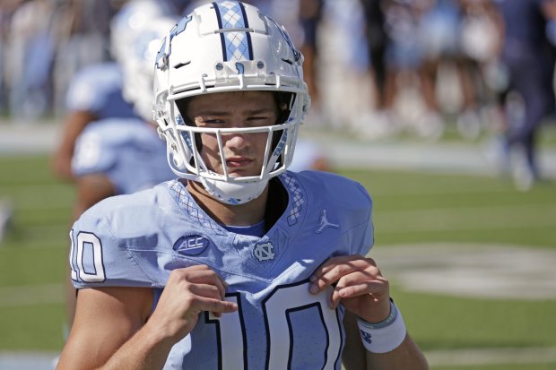 North Carolina quarterback Drake Maye goes through stretches before a game against Syracuse on Oct. 7, 2023, in Chapel Hill, N.C. (AP Photo/Chris Seward)